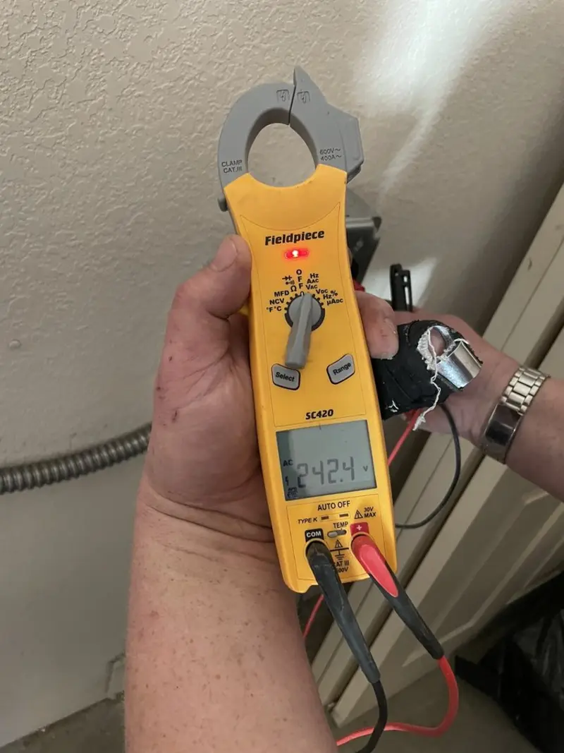 Voltage testing with clamp meter during Whole House Surge Protector in Salem